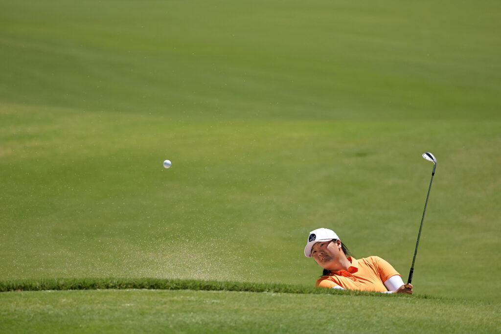 THE WOODLANDS, TEXAS - APRIL 22: Angel Yin of the United States plays a shot from a bunker on the eighth hole during the third round of The Chevron Championship at The Club at Carlton Woods on April 22, 2023 in The Woodlands, Texas. (Photo by Stacy Revere/Getty Images)