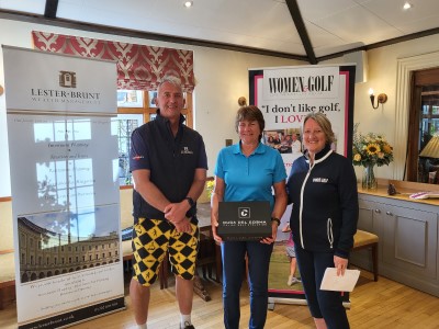 Ed & Kim present Teri with her Duca del Cosma golf shoes