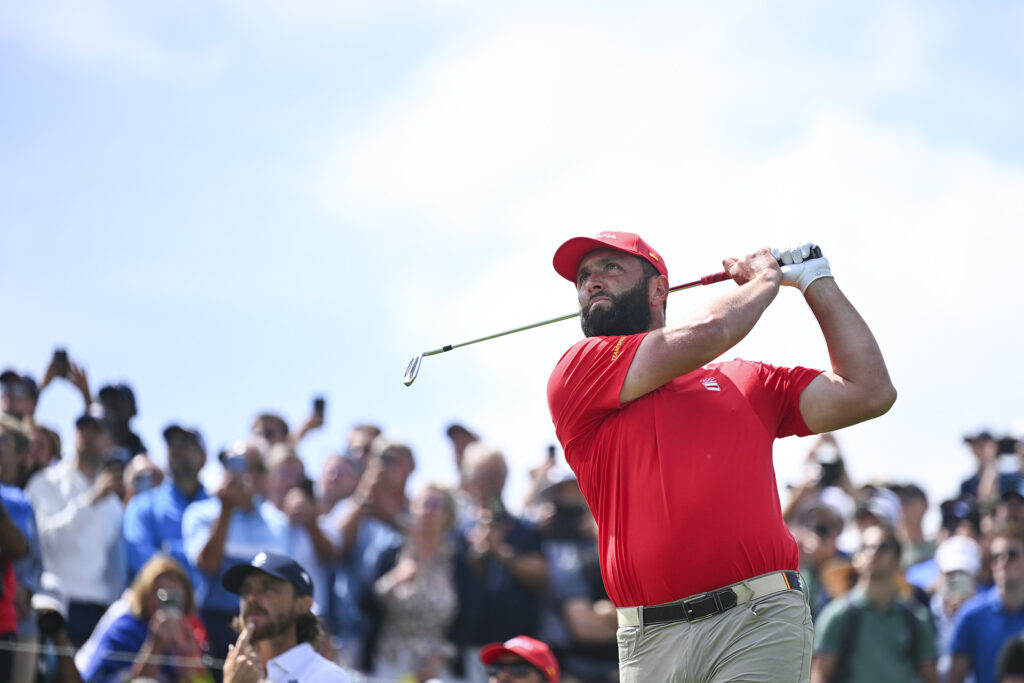 SAINT-QUENTIN-EN-YVELINES, FRANCE - AUGUST 04: Jon Rahm of Team Spain hits his tee shot on the second hole during the final round of the 2024 Paris Olympics at Le Golf National on August 4, 2024 in Saint-Quentin-en-Yvelines, Ile-de-France. (Photo by Tracy Wilcox/PGA TOUR/IGF)