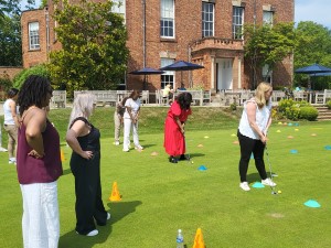 Women putting at Edgbaston Golf Club