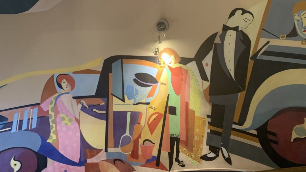 1920s themed mural in hotel reception